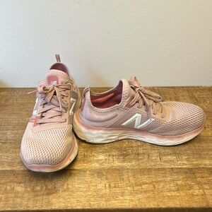 Size 7 New Balances in Pink, lightly worn but no damage.